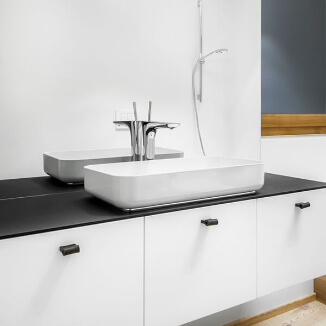 Cabinet hardware made of black leather in bathroom Cabinet hardware made of black leather in bathroom