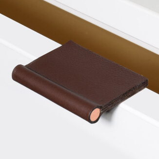 Cabinet hardware made of leather with copper bar Cabinet hardware made of leather with copper bar