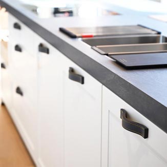 Cabinet hardware FIRENZE made of leather in a kitchen Cabinet hardware FIRENZE made of leather in a kitchen