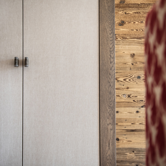 Cabinet handles made of fine suede in gray-brown with white stitching Cabinet handles made of fine suede in gray-brown with white stitching