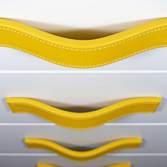Leather handle in yellow with white stitching Leather handles in yellow with white stitching