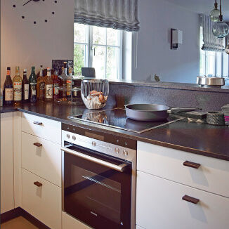 Kitchen handles made of brass and luxury leather Kitchen handles made of brass and luxury leather