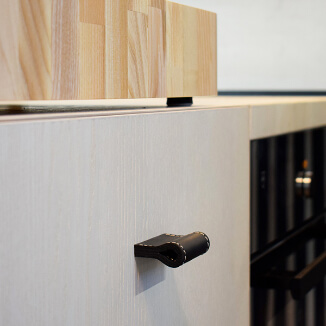 Leather cabinet pulls in black with decorative stitching Leather cabinet pulls in black with decorative stitching