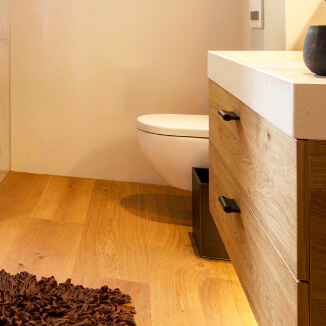 Leather drawer pulls in black in a modern bathroom Leather drawer pulls in black in a modern bathroom