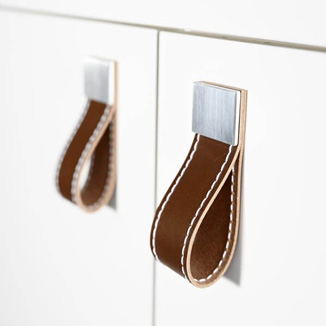 Loop handles made of luxury leather with seams Loop handles made of luxury leather with seams