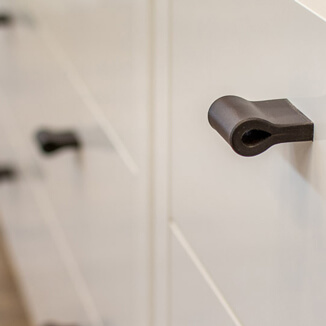 Leather drawer pulls in chocolate brown for shop fittings Leather drawer pulls in chocolate brown for shop fittings