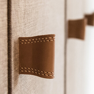 Leather furniture handle in beige brown on built-in wardrobe Leather cabinet pulls in beige brown on built-in wardrobe