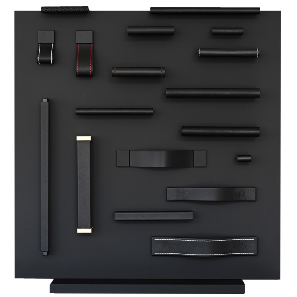 Black leather drawer pulls, handmade by minimaro at a display Black leather drawer pulls, handmade by minimaro at a display