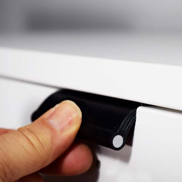 Black edge pulls on white drawer