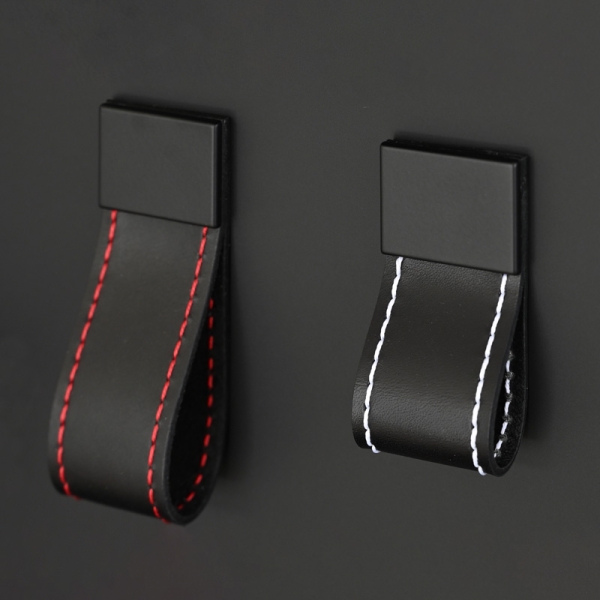 Leather loop handles made of black leather and colorfull seams