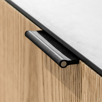 Black VERONA leather edge handle with a metal rod on a wooden front