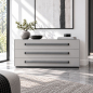 Preview: Three long grey ROMA leather handles with black mounting bases on a minimalist chest of drawers
