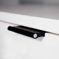 Preview: Black VERONA leather handle with aluminum rod recessed into a white furniture front