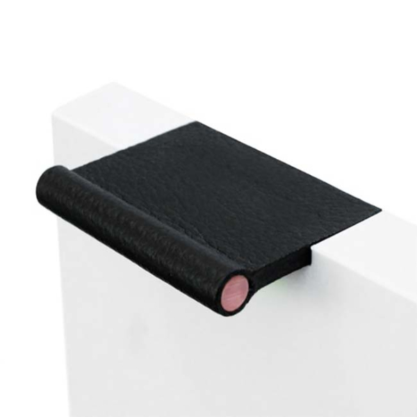Black VERONA recessed leather pull fitted into a white cabinet door