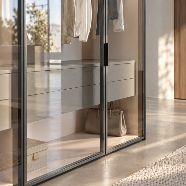 Another overall view of a glass wardrobe with black VERONA handles on the glass doors