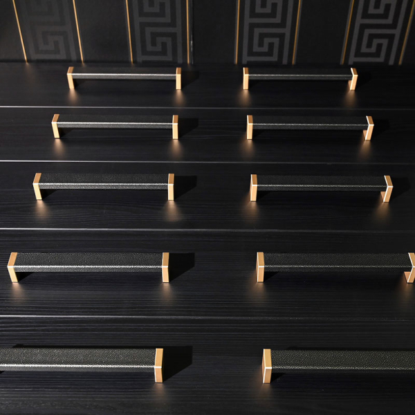 ROMA handles in Black Silver leather with brass mounting bases, arranged in two rows to show different sizes